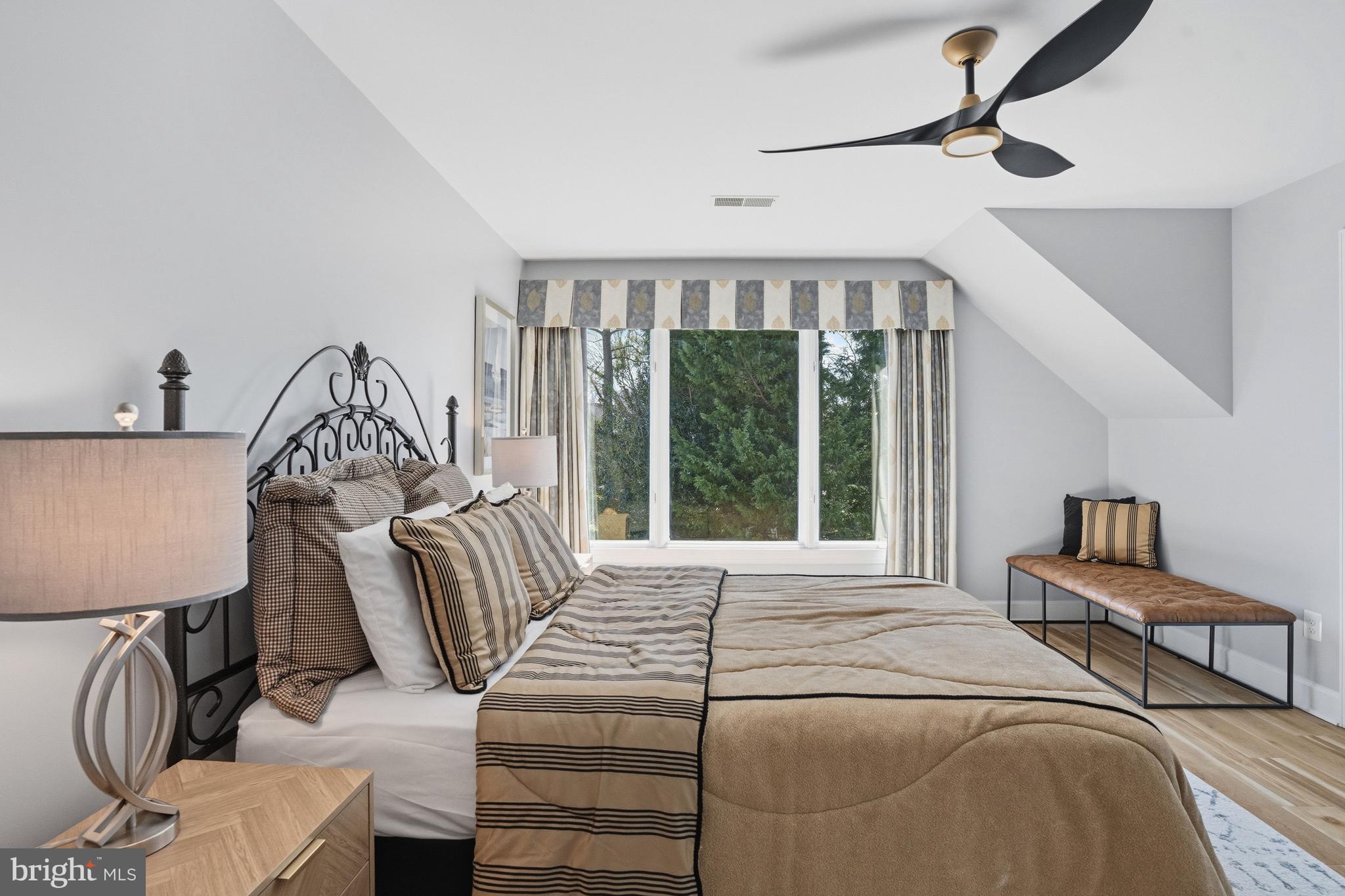 1156 Fieldview Drive Reston, VA 20194 - Photo 72 of 104 a bed sitting in a bedroom next to a window