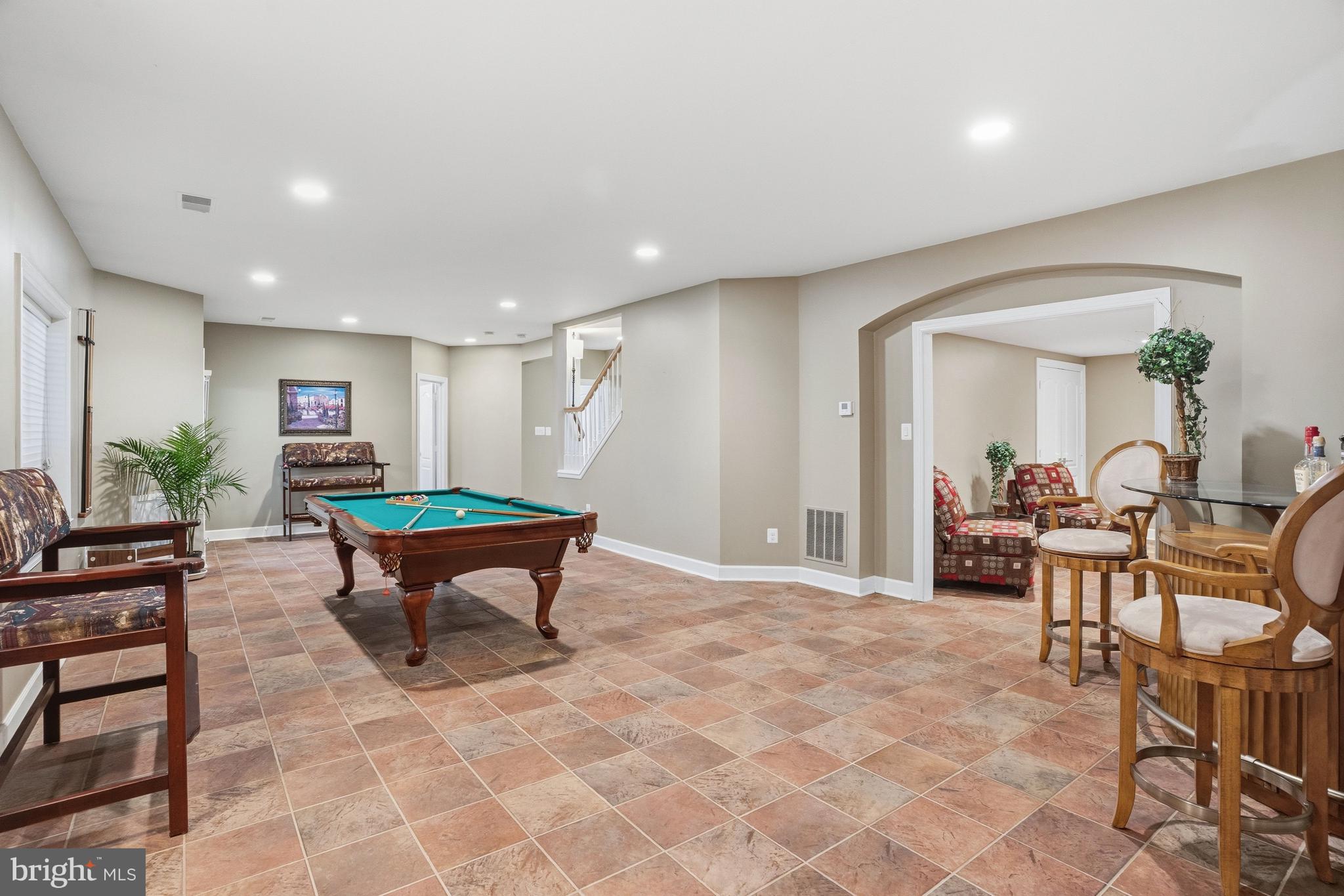 1156 Fieldview Drive Reston, VA 20194 - Photo 87 of 104 a living room with furniture a rug and a table