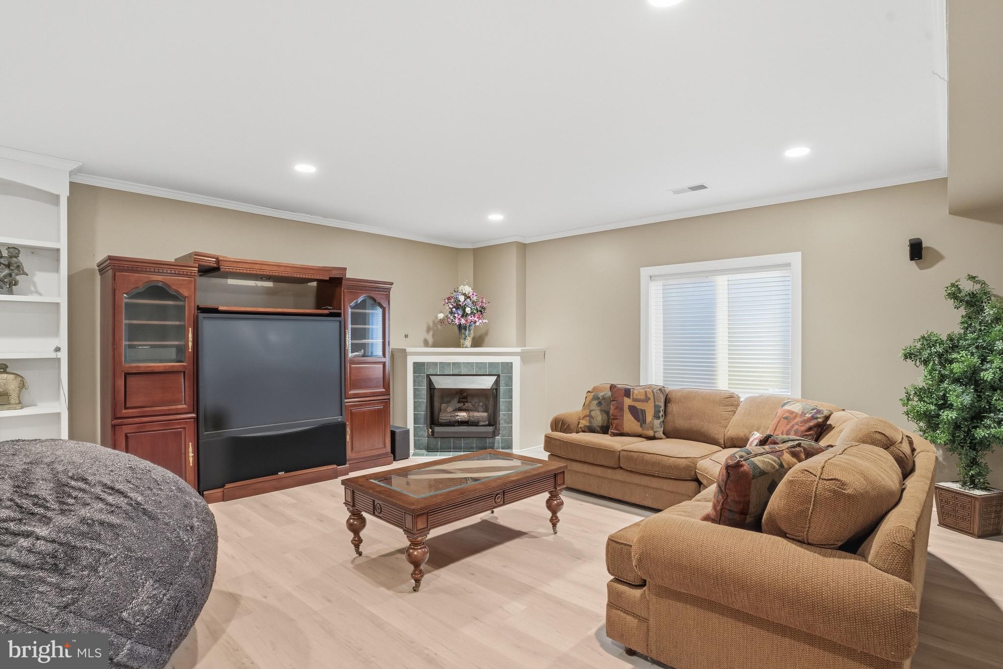 1156 Fieldview Drive Reston, VA 20194 - Photo 91 of 104 a living room with furniture a flat screen tv and a fireplace