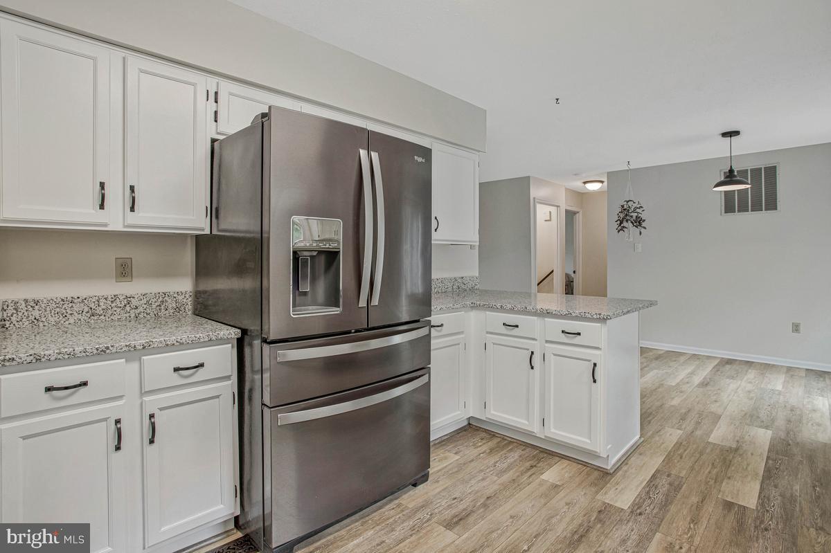 8070 Nursery Road Lusby, MD 20657 - Photo 12 of 47 Modern kitchen with sleek appliances.