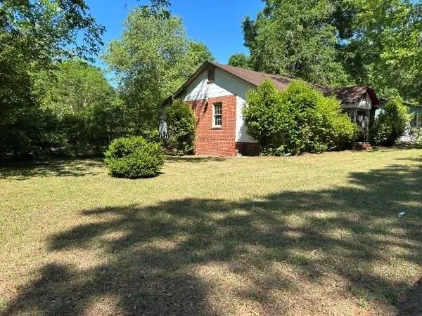 a house with trees in front of it