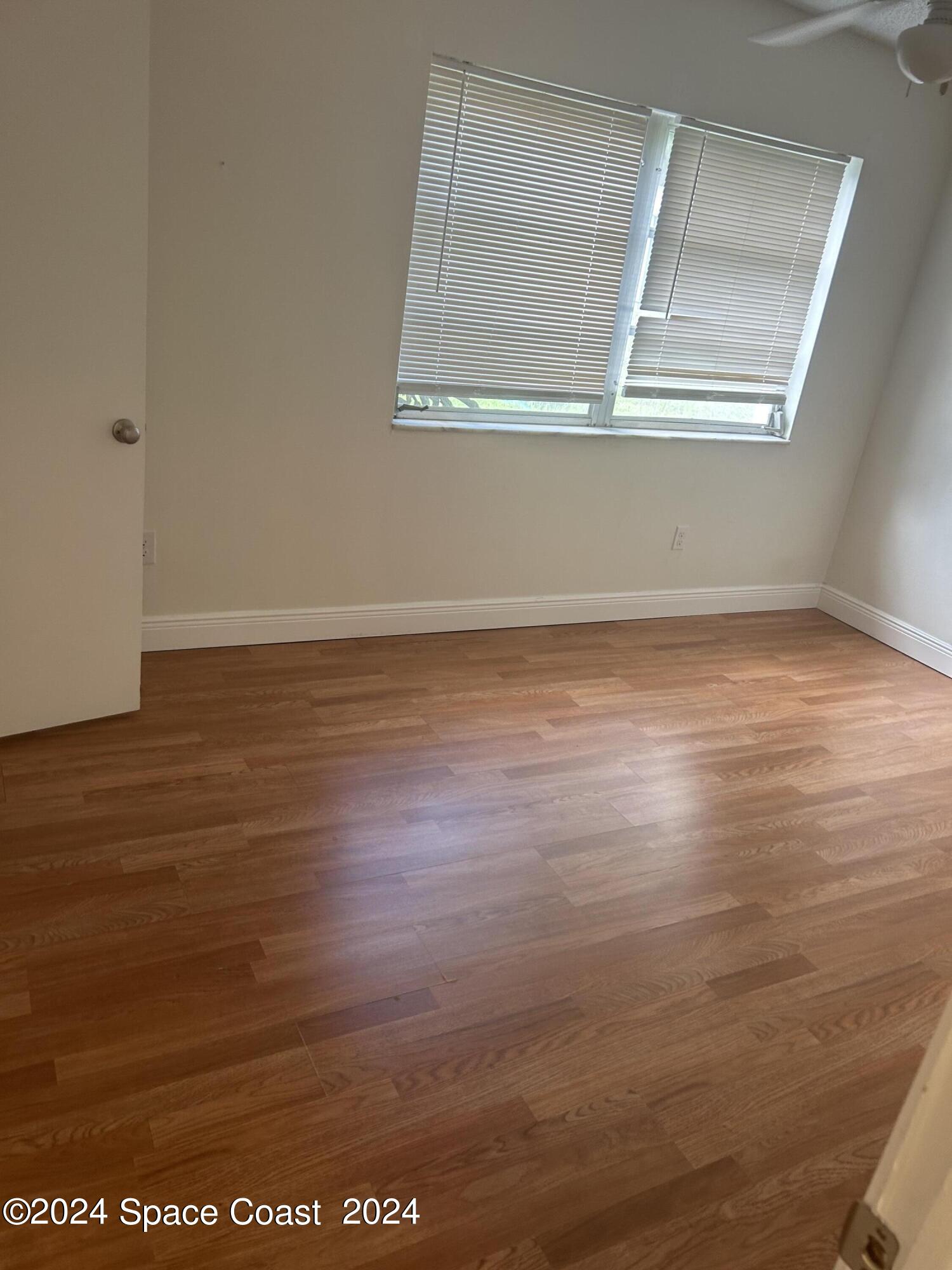 2808 Starlight Circle Northeast Palm Bay, FL 32905 - Photo 11 of 15 a view of a room with wooden floor