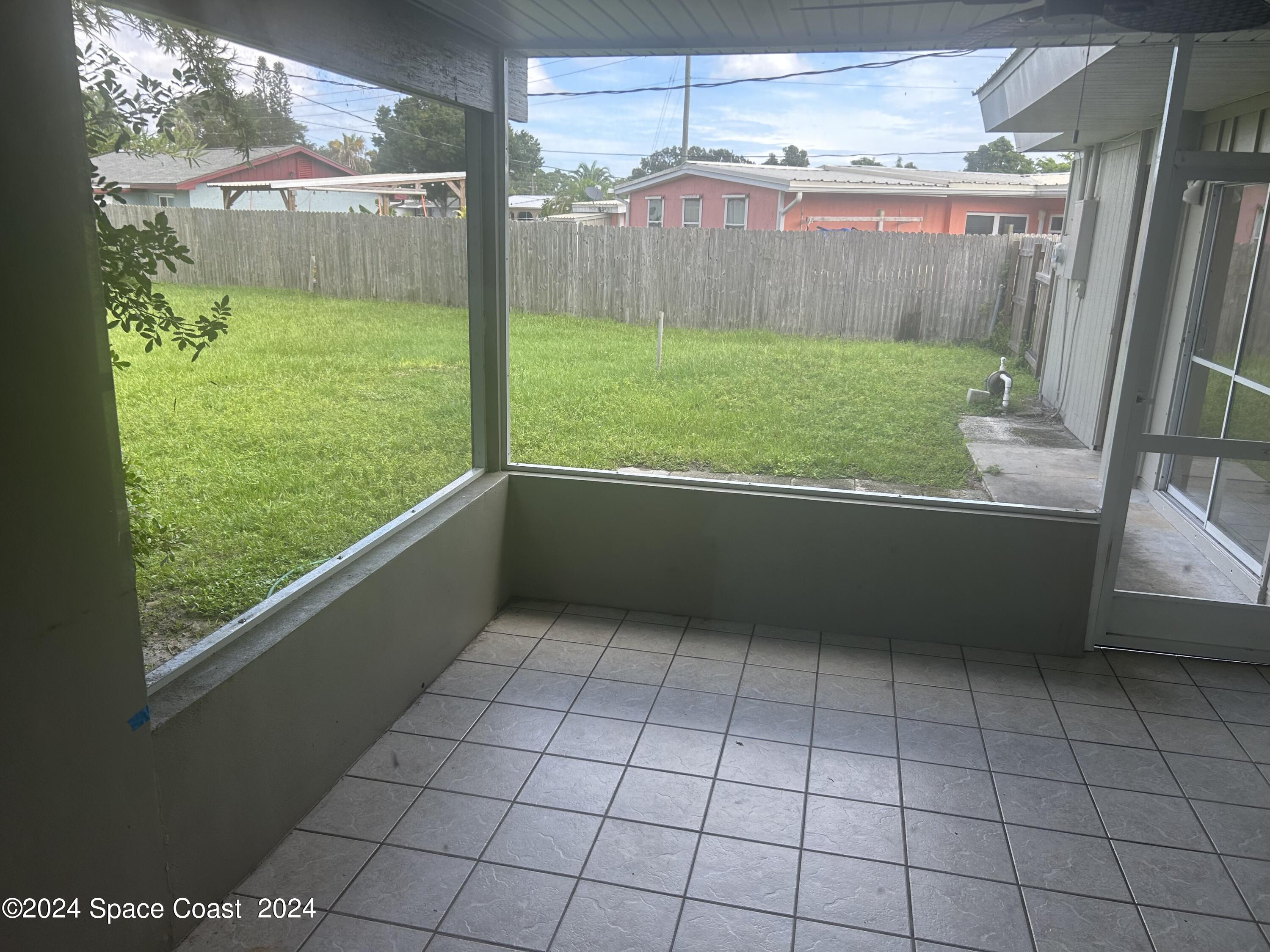 2808 Starlight Circle Northeast Palm Bay, FL 32905 - Photo 14 of 15 a view of a back yard from a balcony