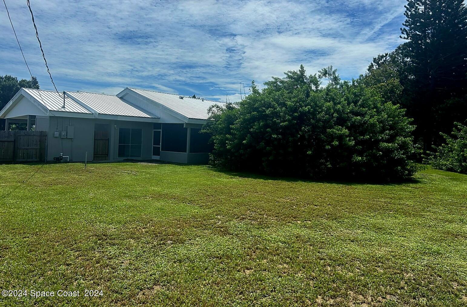 2808 Starlight Circle Northeast Palm Bay, FL 32905 - Photo 15 of 15 a view of a backyard of the house