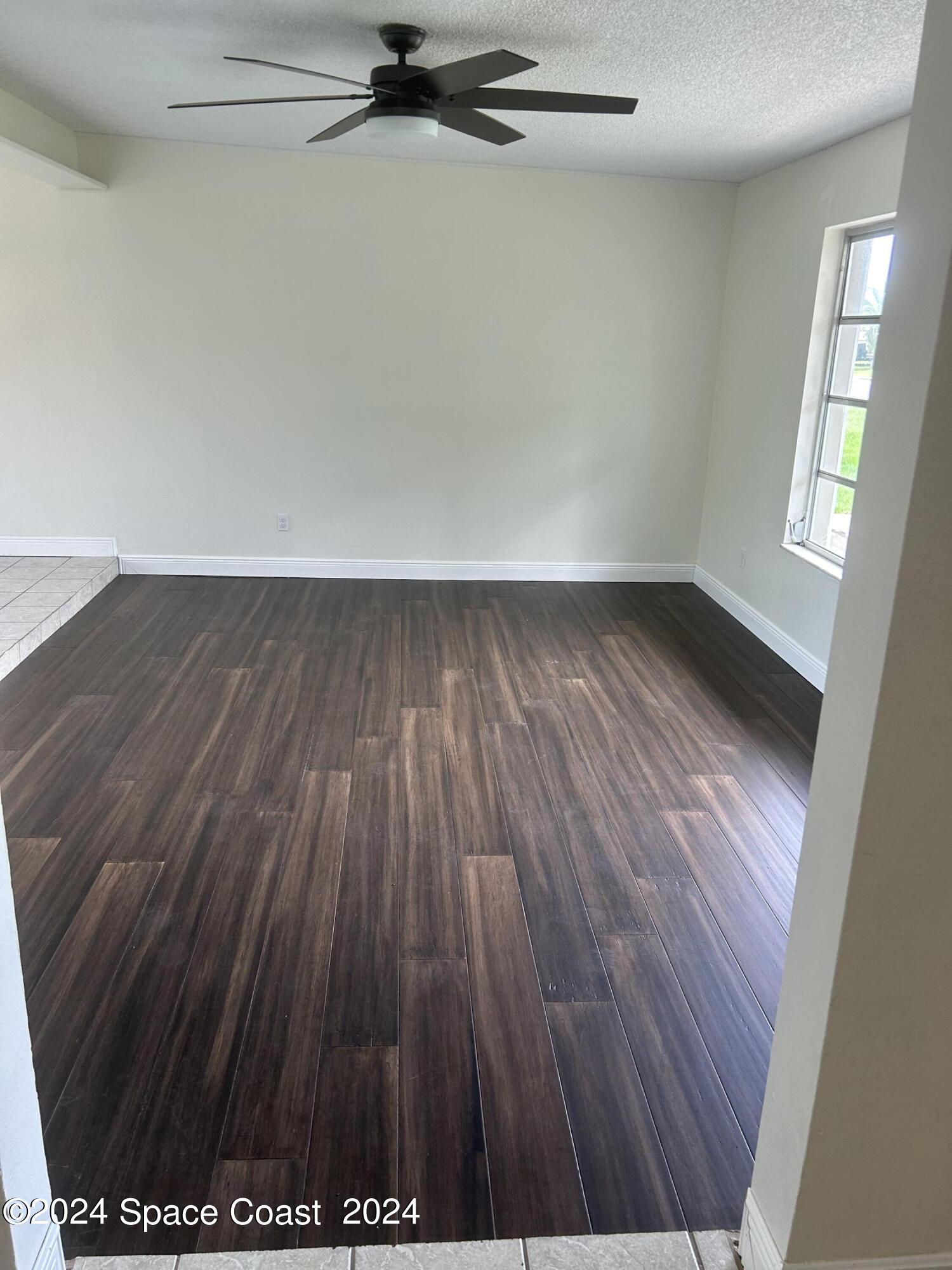 2808 Starlight Circle Northeast Palm Bay, FL 32905 - Photo 5 of 15 a view of a room with wooden floor