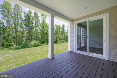 a view of a room with wooden floor and outdoor space