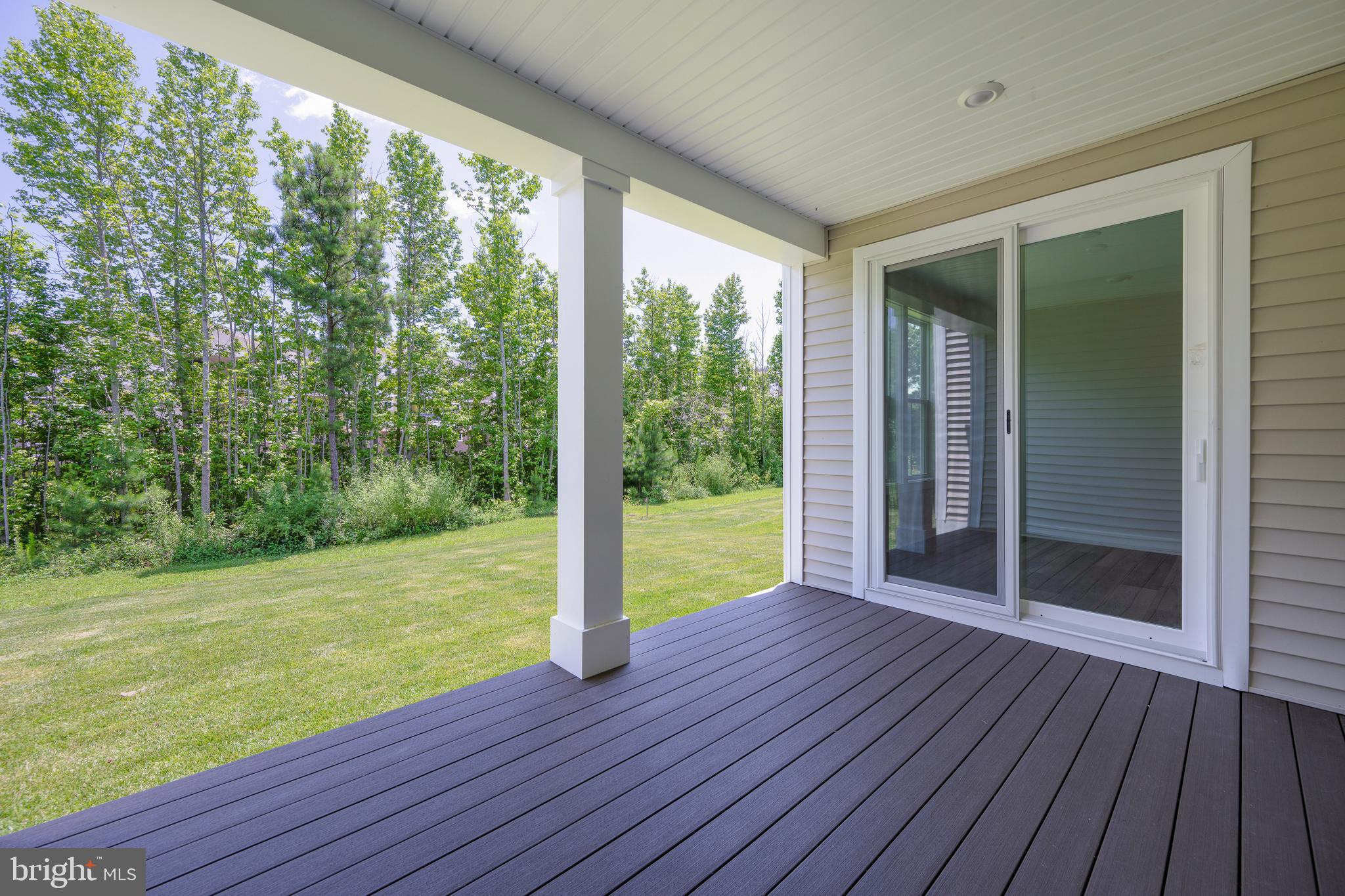 24166 Heartleaf Road Frankford, DE 19945 - Photo 18 of 28 a view of a room with wooden floor and outdoor space