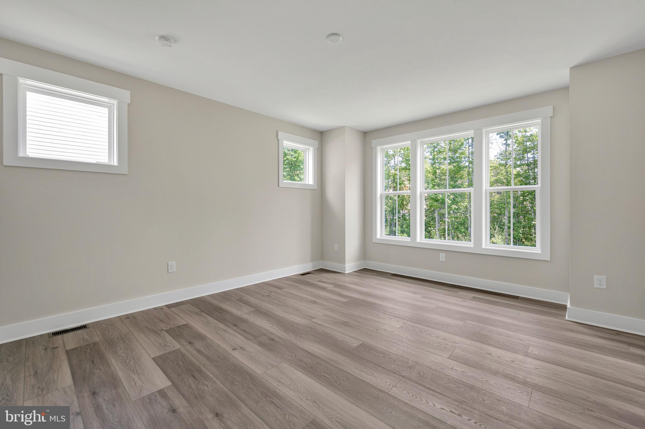 24166 Heartleaf Road Frankford, DE 19945 - Photo 21 of 28 a view of an empty room with wooden floor and a window