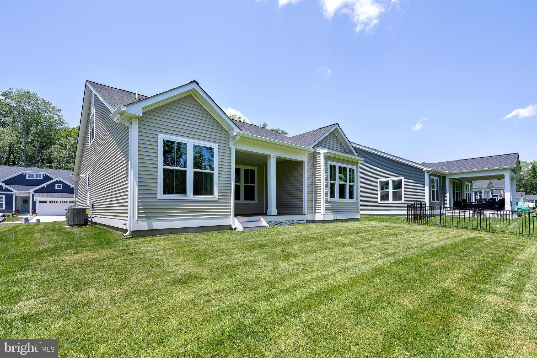 24166 Heartleaf Road Frankford, DE 19945 - Photo 3 of 28 a front view of house with yard and green space