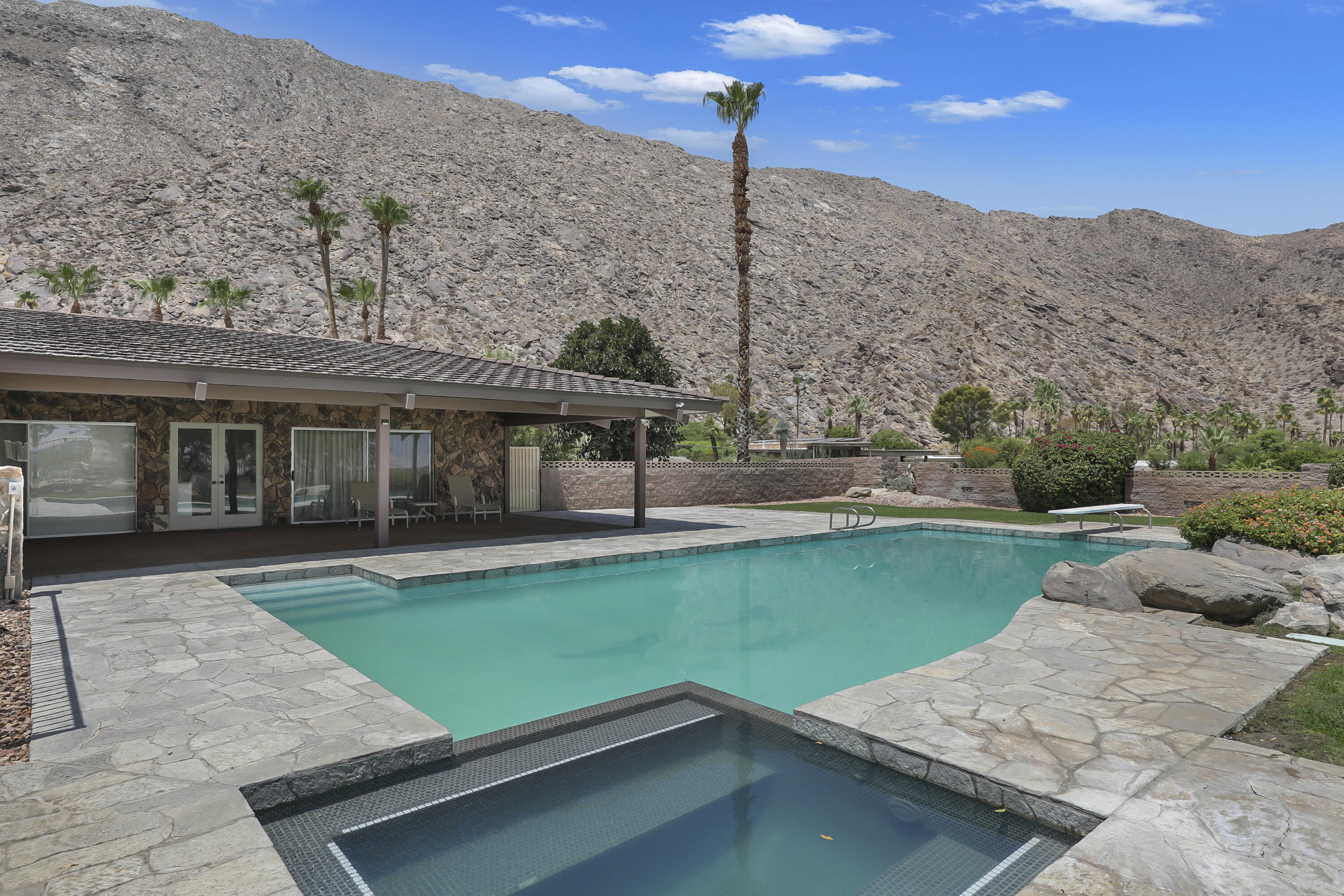 770 South La Mirada Road Palm Springs, CA 92264 - Photo 29 of 39 a view of a house with a yard