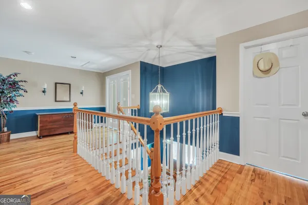 a view of a livingroom with a ceiling fan and window