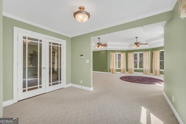 a view of an empty room with a fireplace