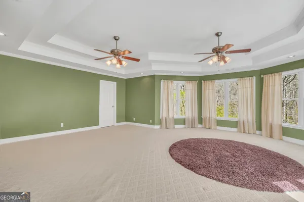 a view of an empty room with a fireplace