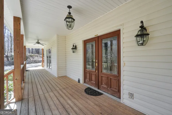 a view of balcony with wooden floor