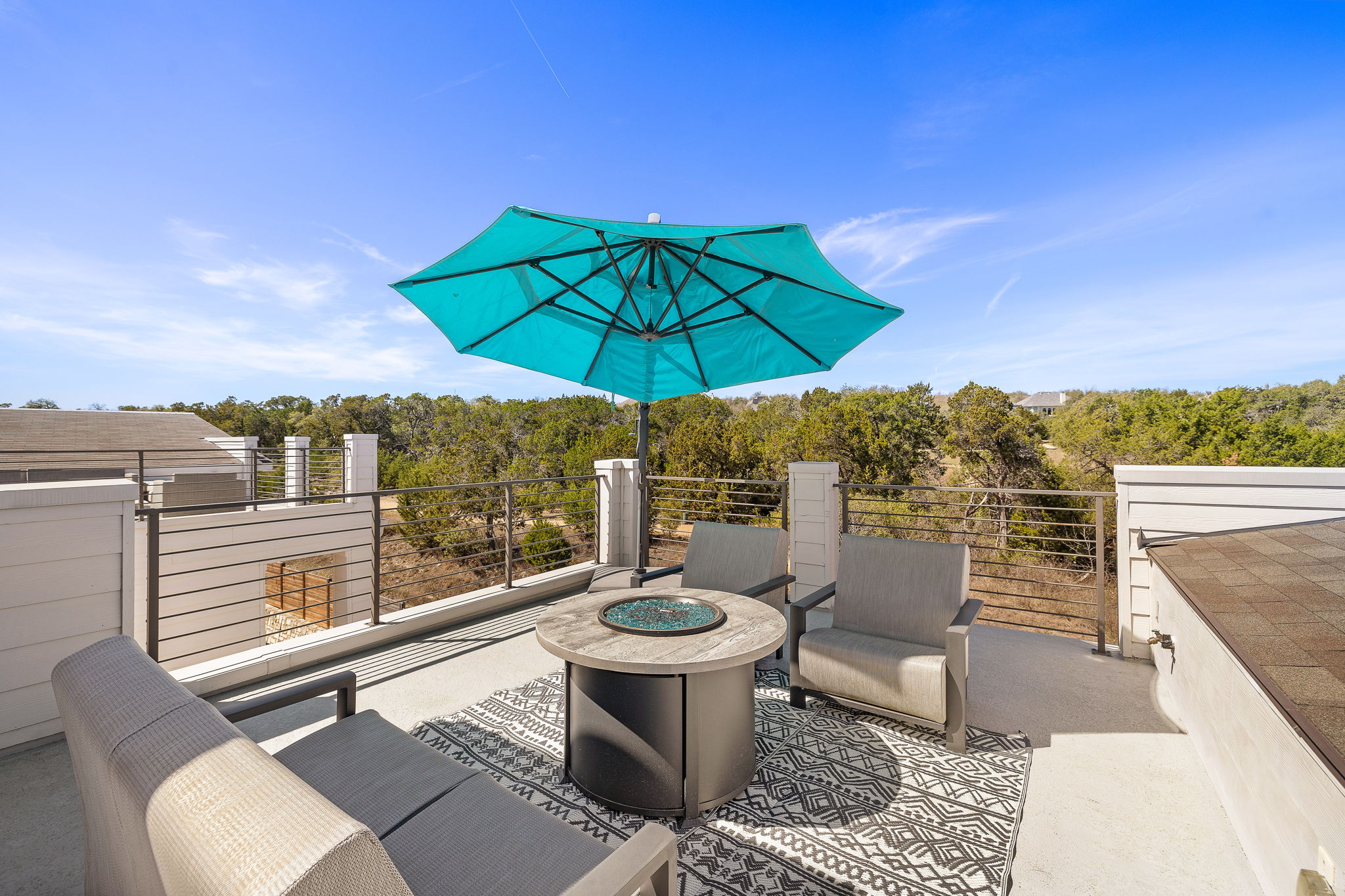 5214 Pink Poppy Pass Austin, TX 78735 - Photo 4 of 34 View of patio / terrace featuring a wooded view and an outdoor living space with a fire pit