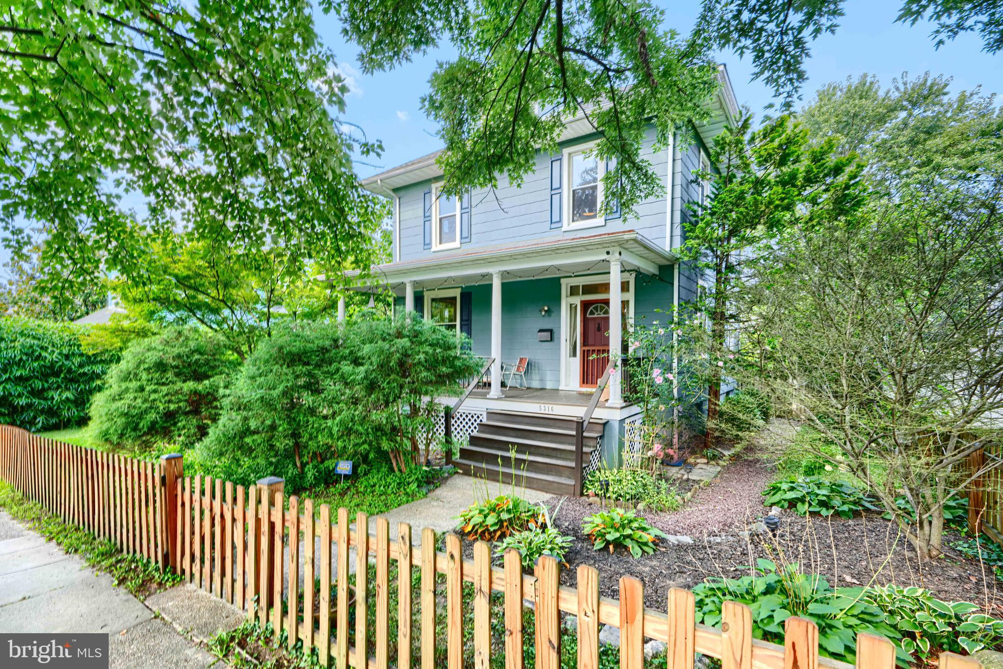 5316 Catalpha Road Baltimore, MD 21214 - Photo 1 of 54 a front view of a house with a garden