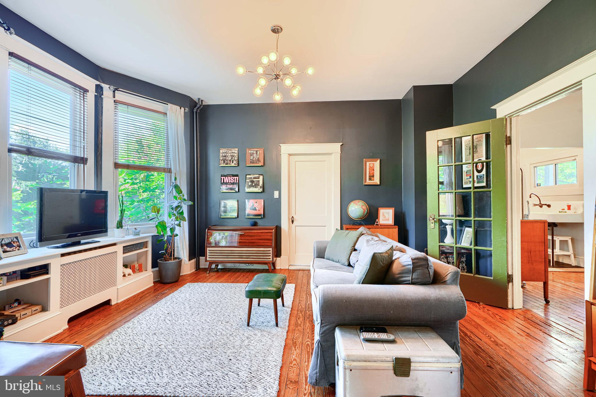 5316 Catalpha Road Baltimore, MD 21214 - Photo 11 of 54 a living room with furniture and a flat screen tv