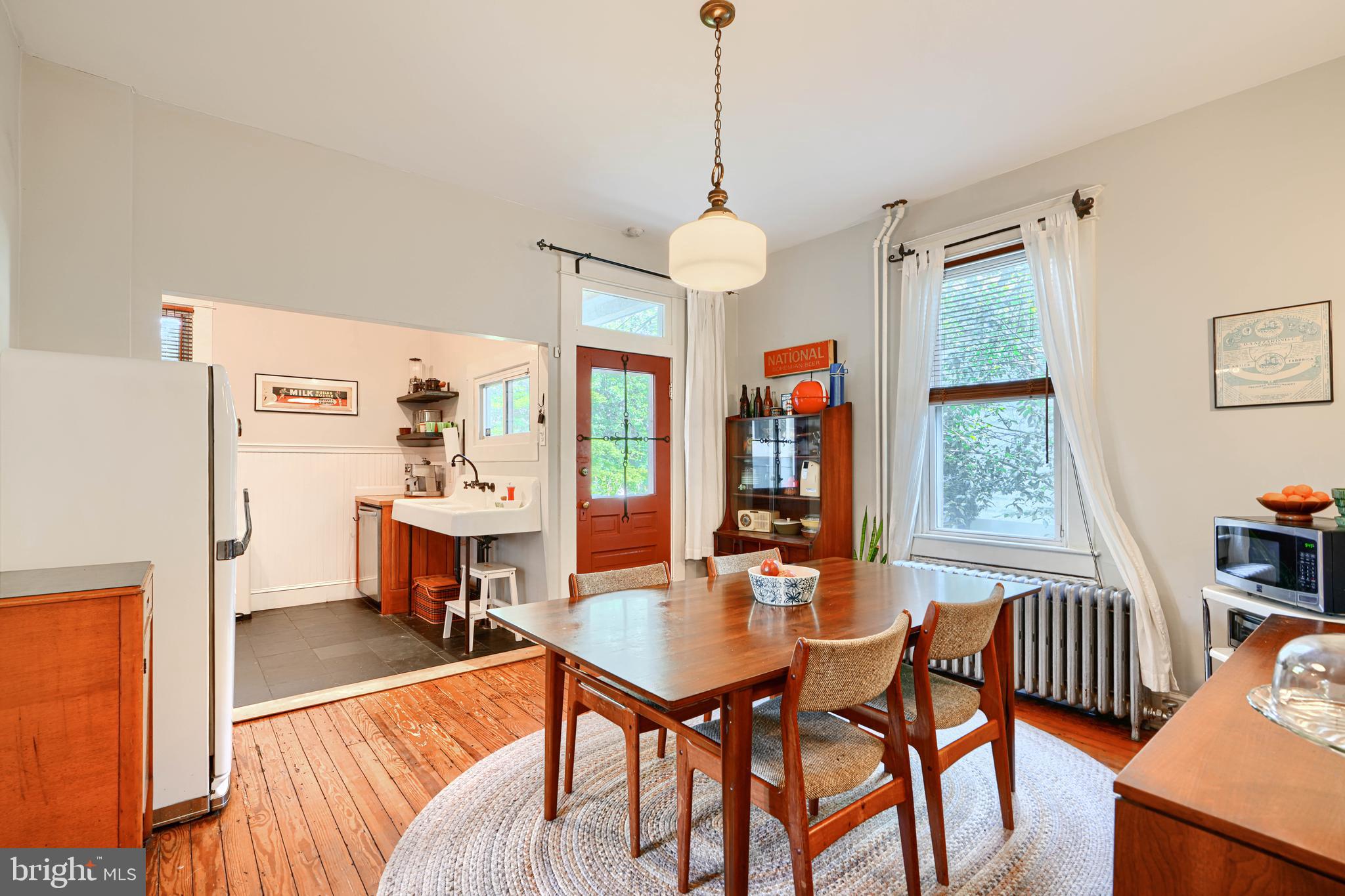 5316 Catalpha Road Baltimore, MD 21214 - Photo 13 of 54 a view of a dining room with furniture window and outside view