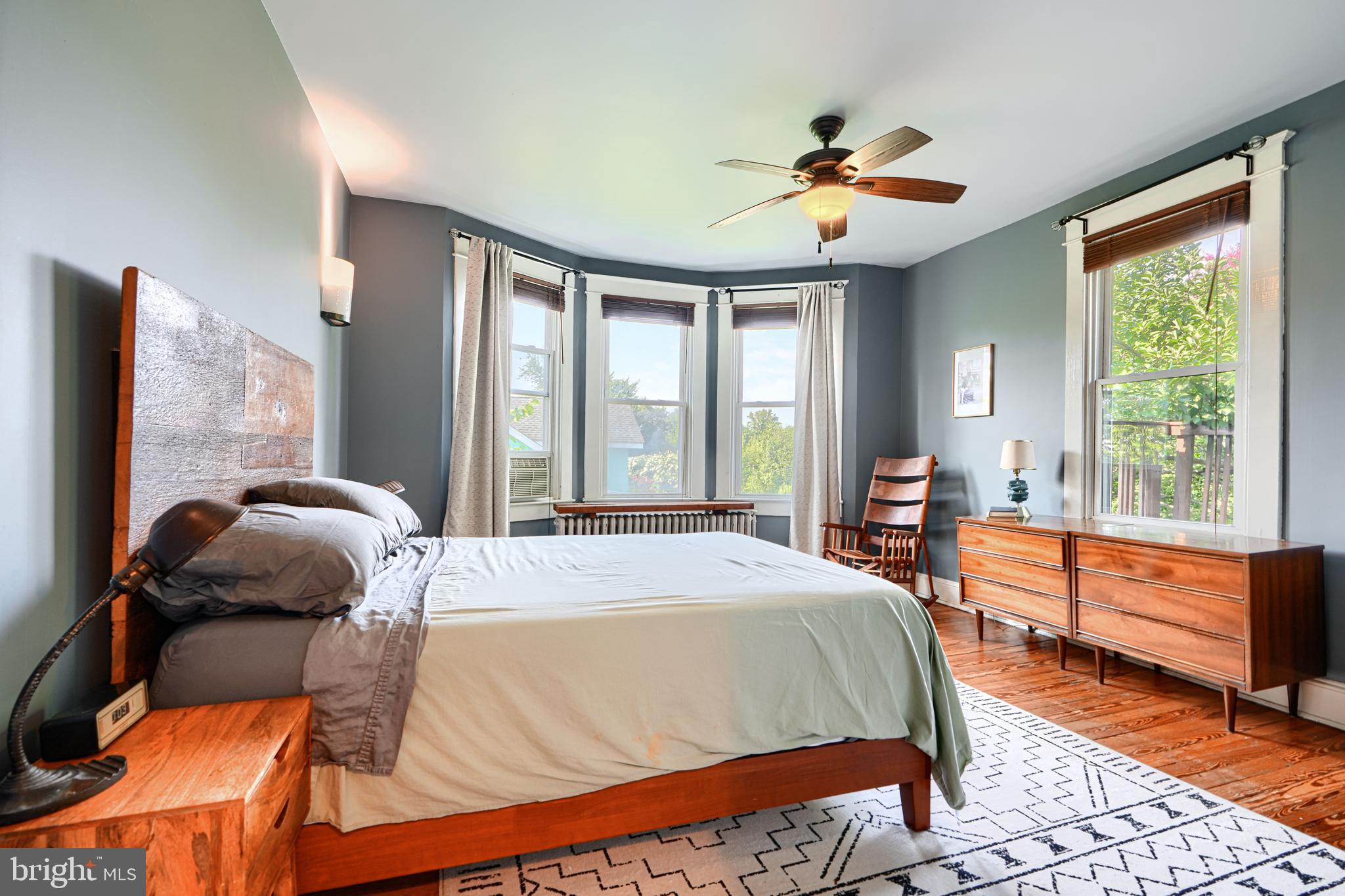 5316 Catalpha Road Baltimore, MD 21214 - Photo 21 of 54 a bedroom with a large bed and a chandelier