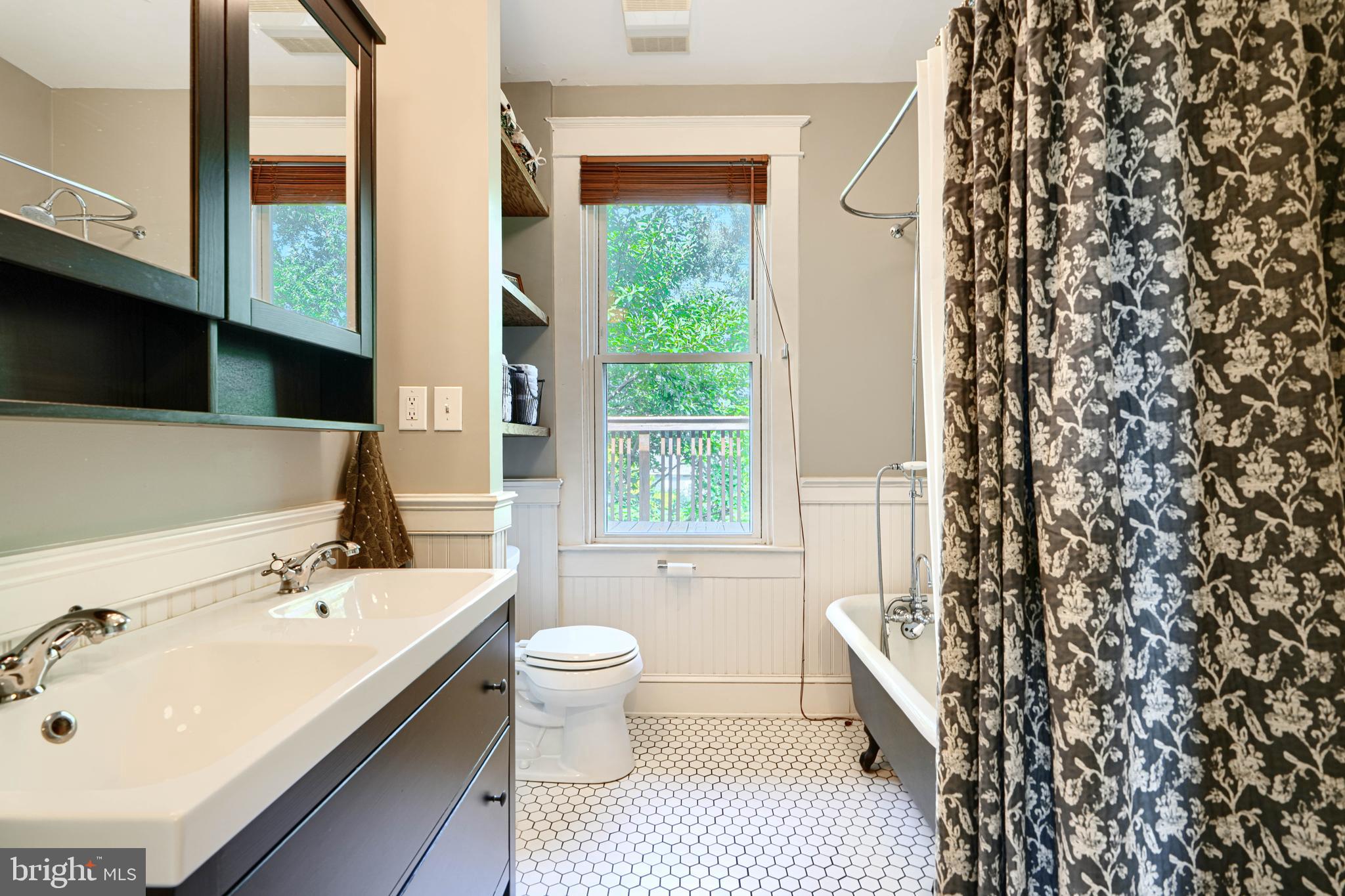 5316 Catalpha Road Baltimore, MD 21214 - Photo 23 of 54 a bathroom with a sink toilet a tub and shower