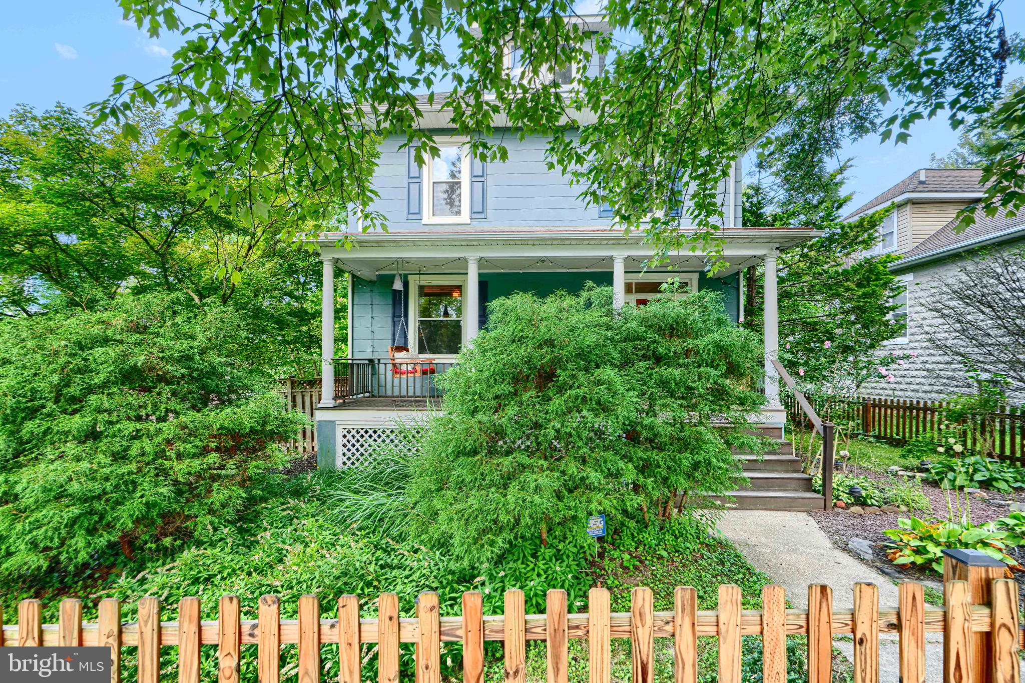 5316 Catalpha Road Baltimore, MD 21214 - Photo 49 of 54 a front view of a house with a garden