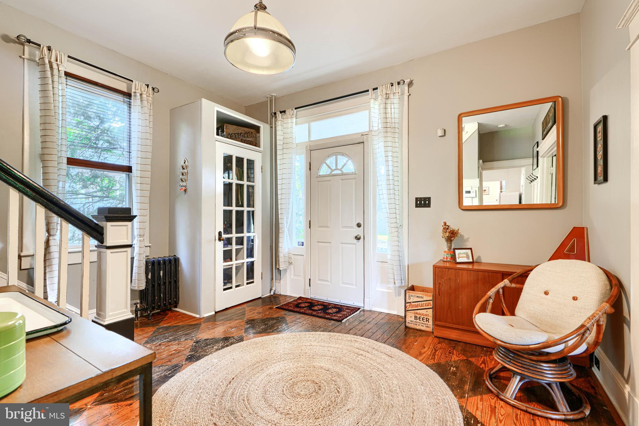 5316 Catalpha Road Baltimore, MD 21214 - Photo 6 of 54 a living room with furniture a flat screen tv and a window