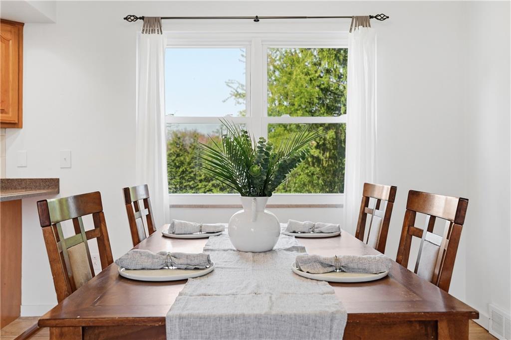 835 Wible Run Road Pittsburgh, PA 15209 - Photo 12 of 50 a view of a dining room with furniture window and wooden floor