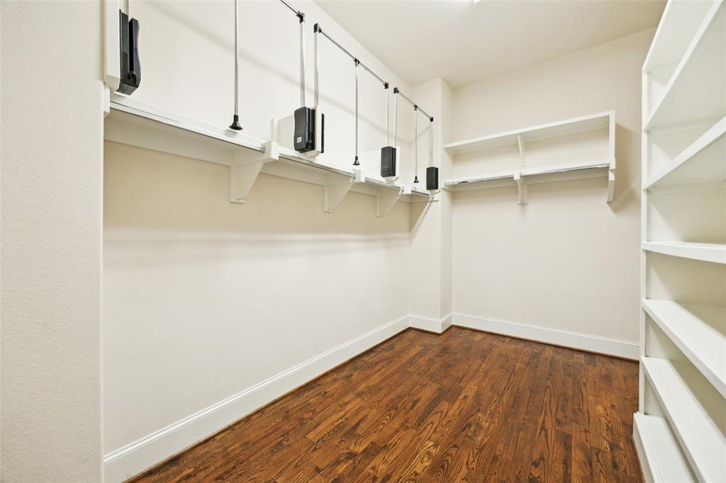 2134 Canton Street Dallas, TX 75201 - Photo 12 of 34 Spacious closet with dark wood finished floors