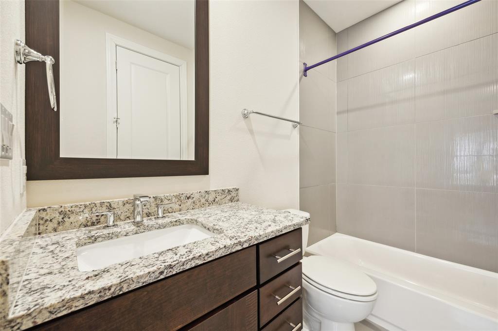 2134 Canton Street Dallas, TX 75201 - Photo 17 of 34 Full bathroom with vanity and shower combination