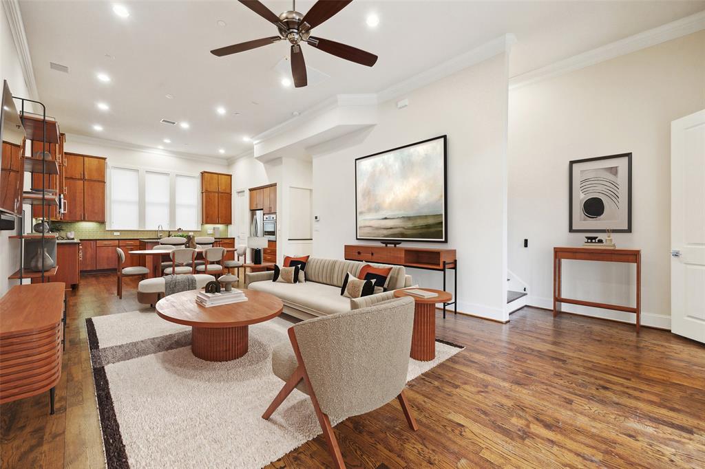 2134 Canton Street Dallas, TX 75201 - Photo 2 of 34 Living area with crown molding, dark wood-type flooring, recessed lighting, and a ceiling fan