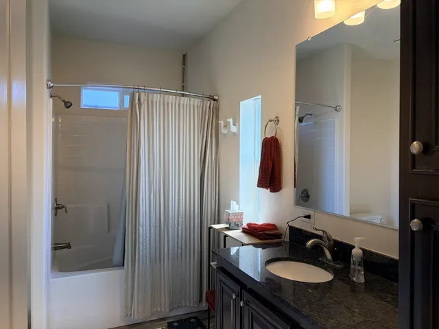 a white toilet sitting next to a bathroom sink