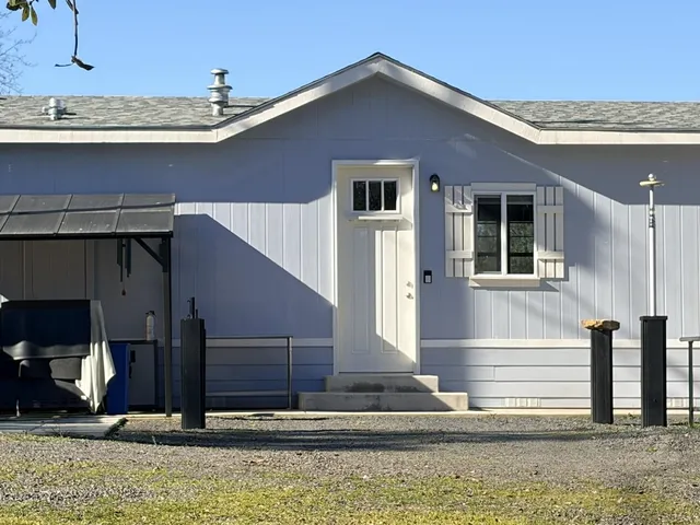 a view of yard with swimming pool and green space