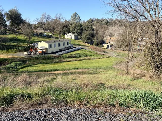 a view of a chair and table in the patio