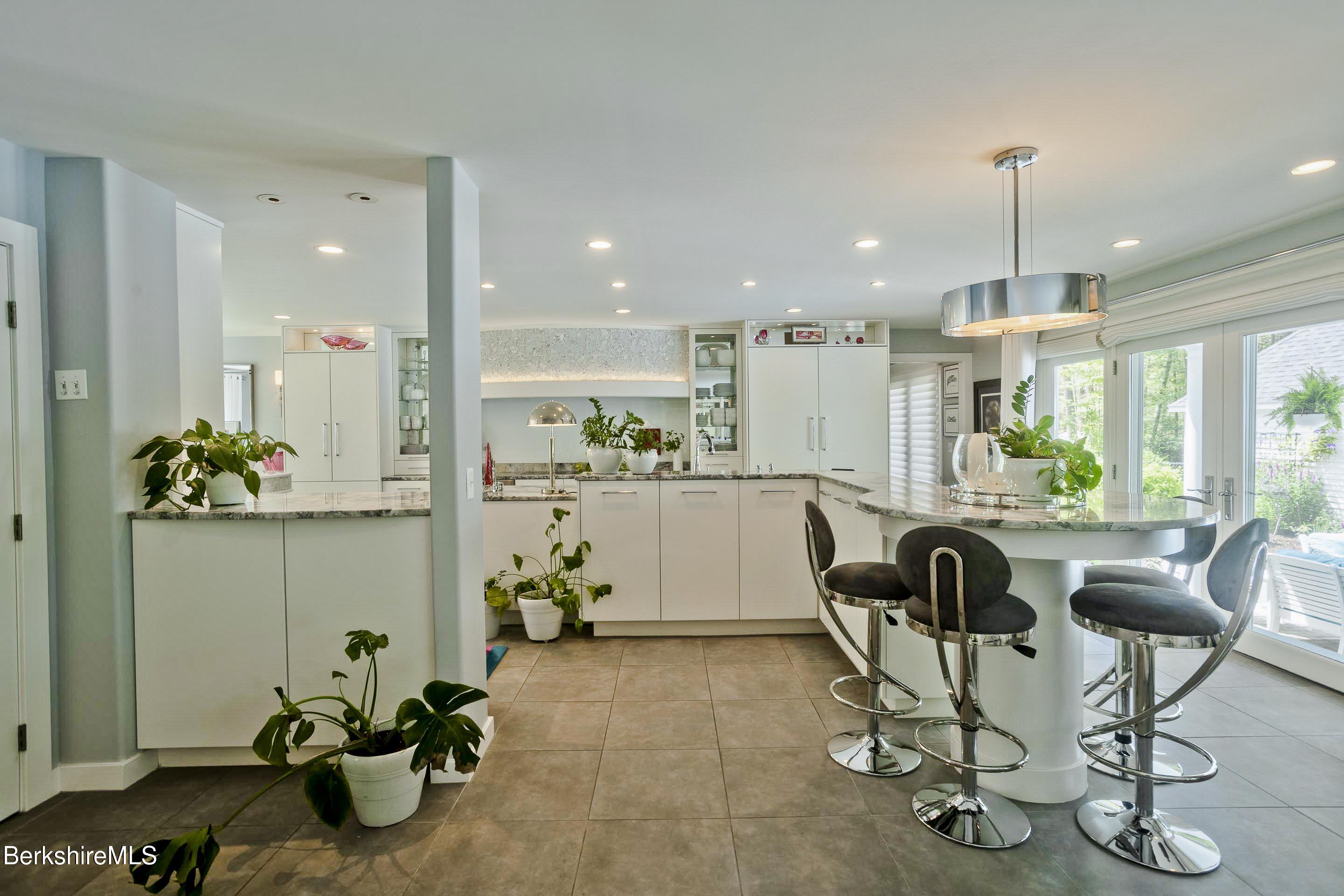 183 Loomis Ridge Road Westfield, MA 01085 - Photo 5 of 39 a dining room filled chandelier and kitchen view