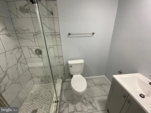 a bathroom with a toilet and a sink