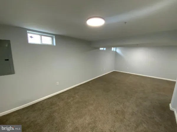 an empty room with a empty space and window