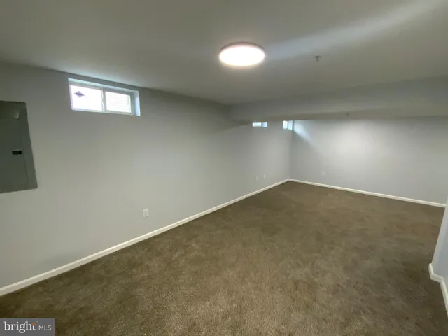 an empty room with a empty space and window