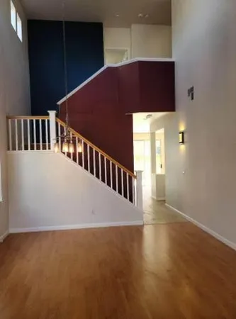 a view of an empty room with windows