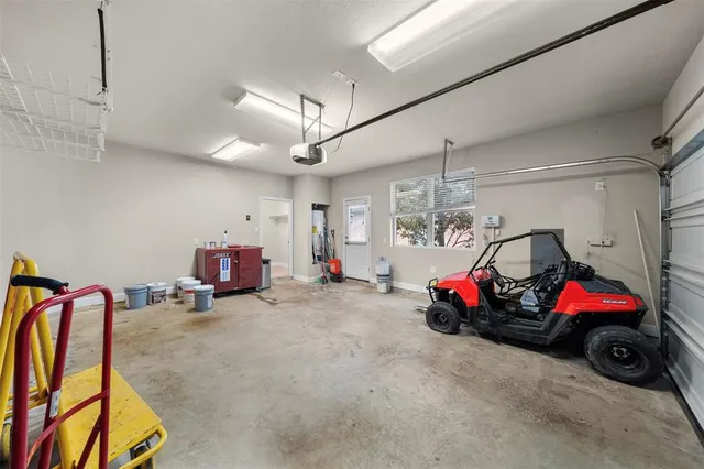 a view of a patio with table and chairs and potted plants