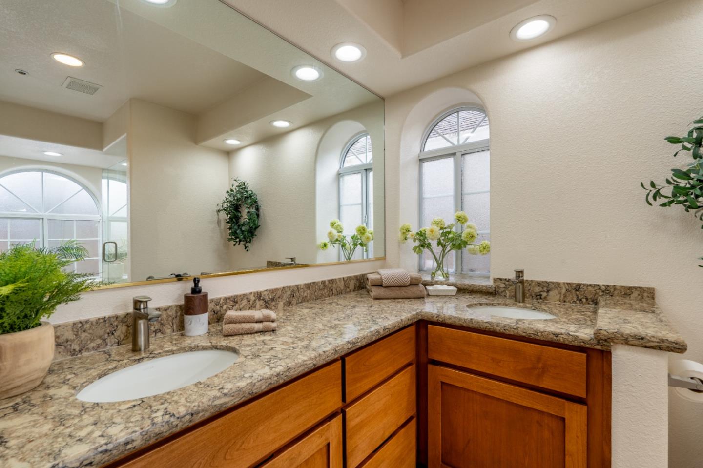 204 Ridge Road Pacific Grove, CA 93950 - Photo 11 of 15 a bathroom with a granite countertop sink and a mirror