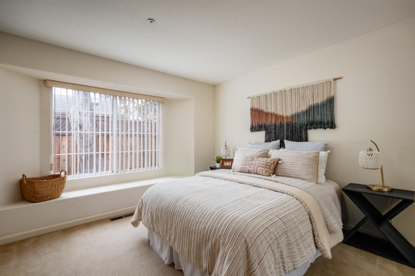 204 Ridge Road Pacific Grove, CA 93950 - Photo 12 of 15 a bedroom with a bed and a window