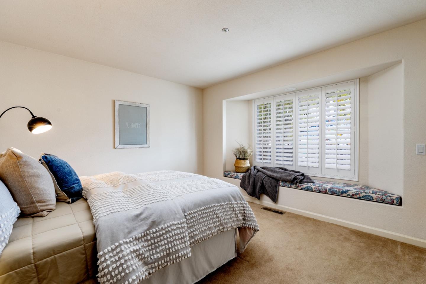 204 Ridge Road Pacific Grove, CA 93950 - Photo 13 of 15 a bedroom with a bed and a couch