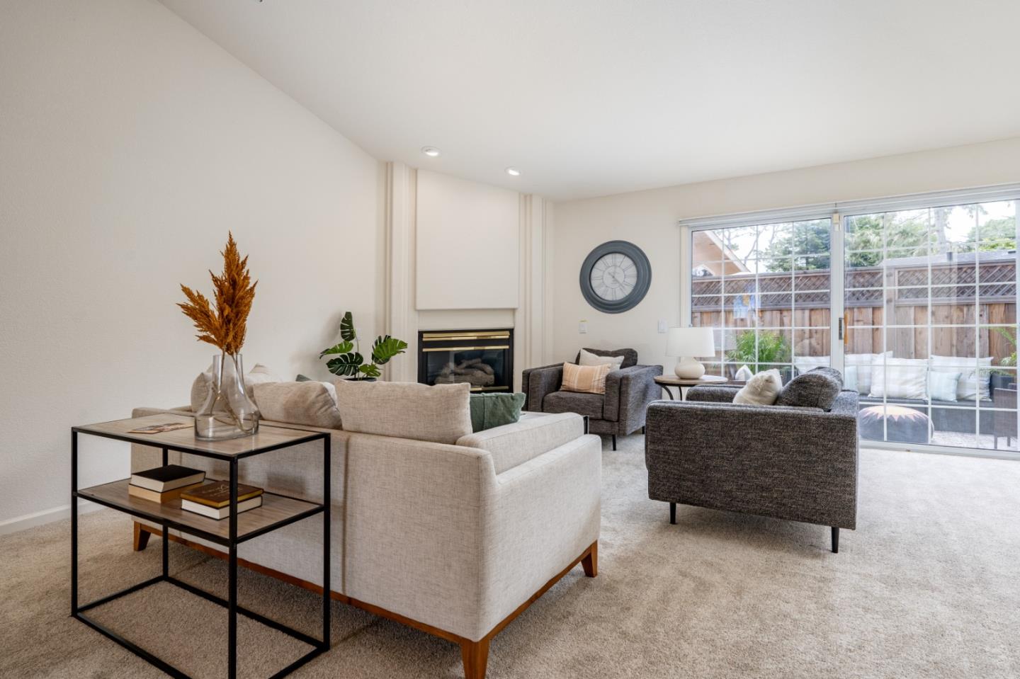 204 Ridge Road Pacific Grove, CA 93950 - Photo 3 of 15 a living room with fireplace furniture and a large window