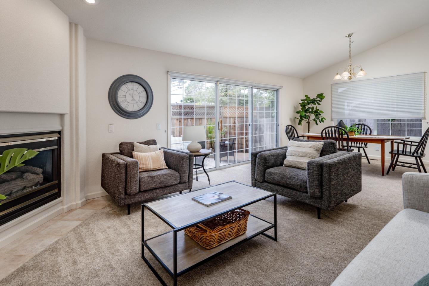 204 Ridge Road Pacific Grove, CA 93950 - Photo 4 of 15 a living room with furniture and a fireplace