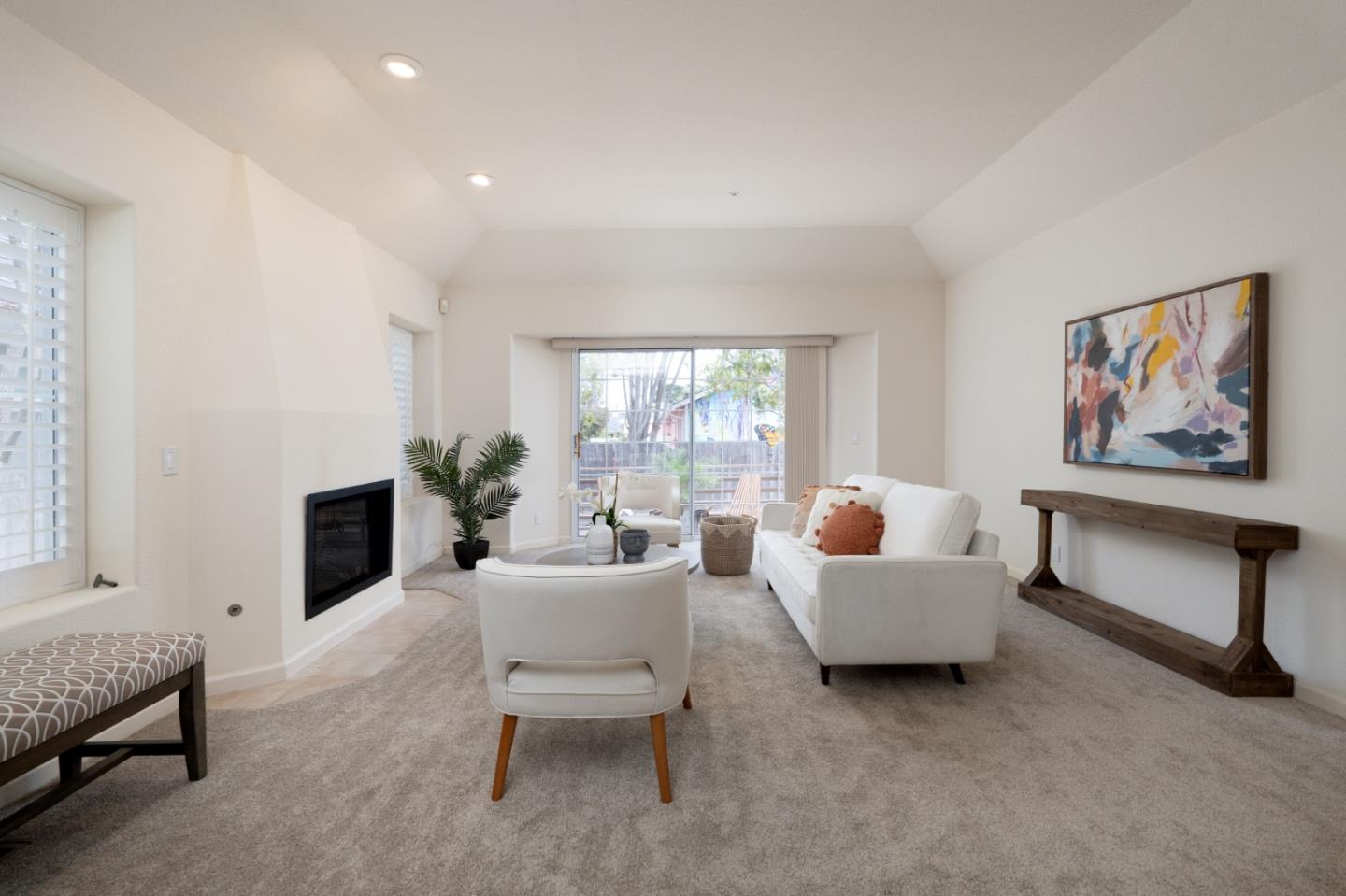 204 Ridge Road Pacific Grove, CA 93950 - Photo 8 of 15 a living room with furniture a window and a fireplace