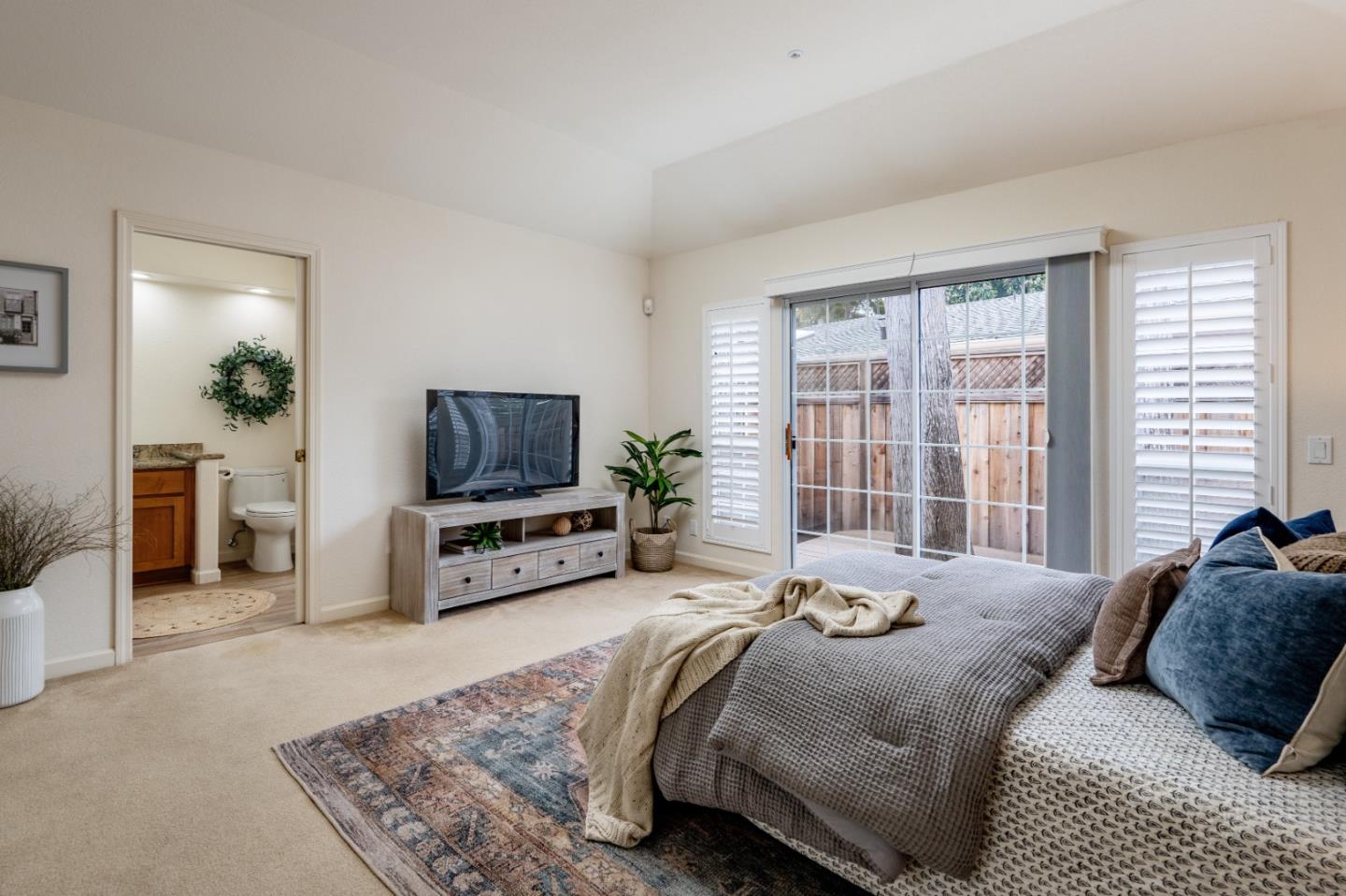 204 Ridge Road Pacific Grove, CA 93950 - Photo 9 of 15 a bedroom with a bed and a television