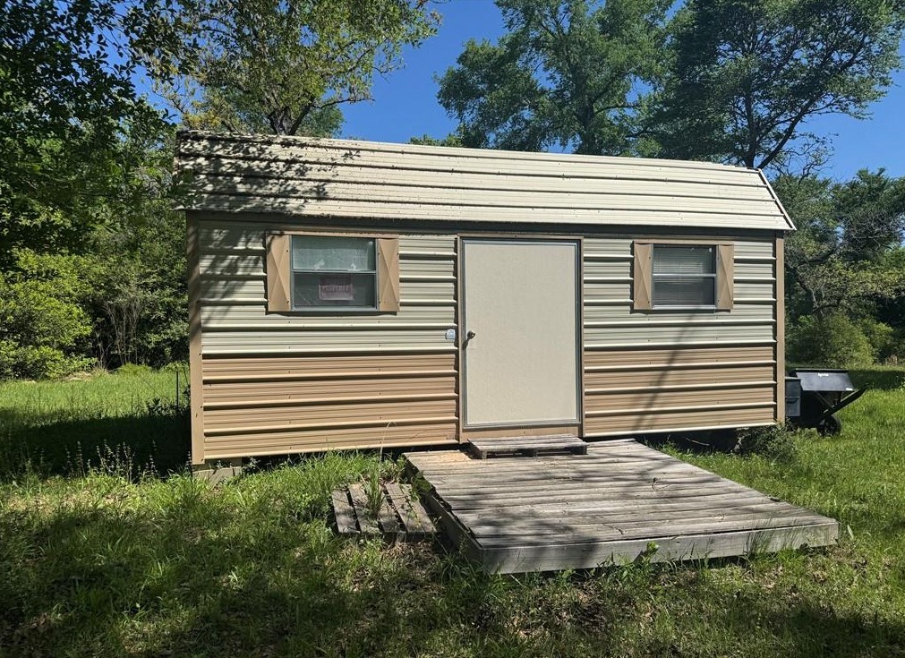 18242 Old Bundick Road Bryan, TX 77808 - Photo 11 of 13 a view of a house with a yard