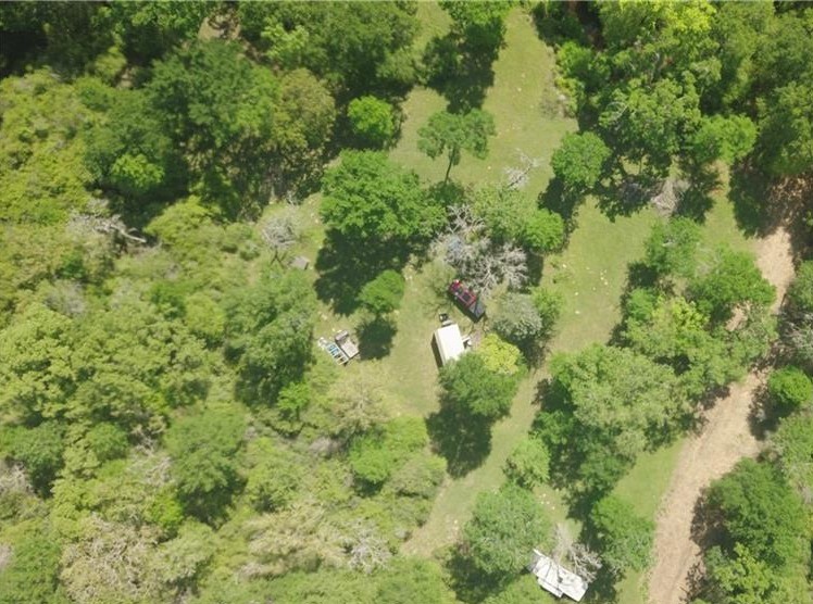 18242 Old Bundick Road Bryan, TX 77808 - Photo 5 of 13 a view of a forest with a houses