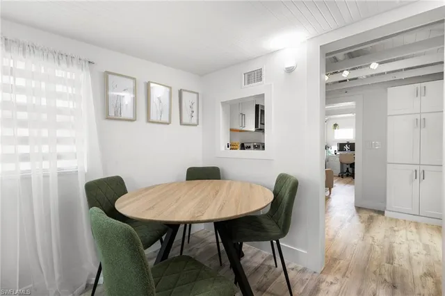 a kitchen with a microwave stove top oven and cabinets