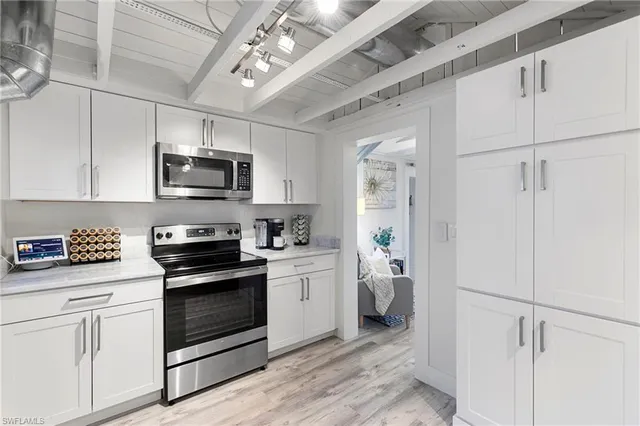 a kitchen with a stove and a microwave